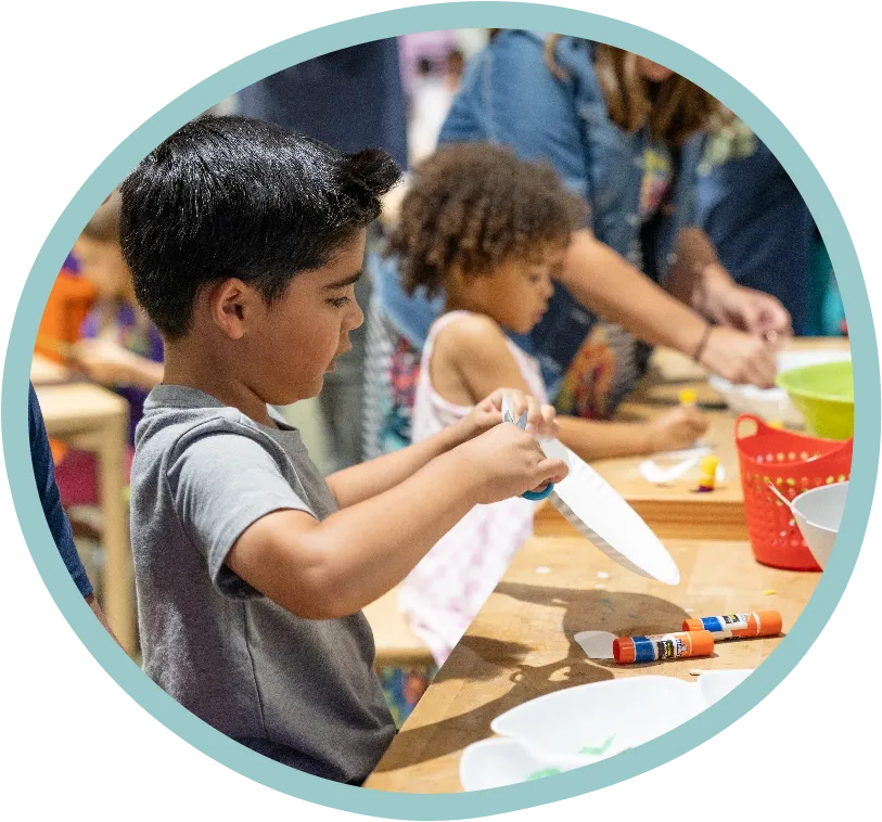 children doing crafts in steamworks in the Children's Museum of the Upstate Greenville location.