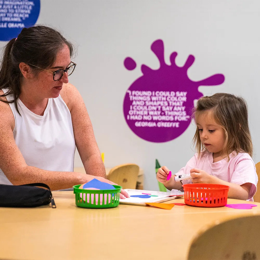 Mom and daughter making arts and crafts at the open art studios exhibit at the Children's Museum of the Upstate Greenville location.