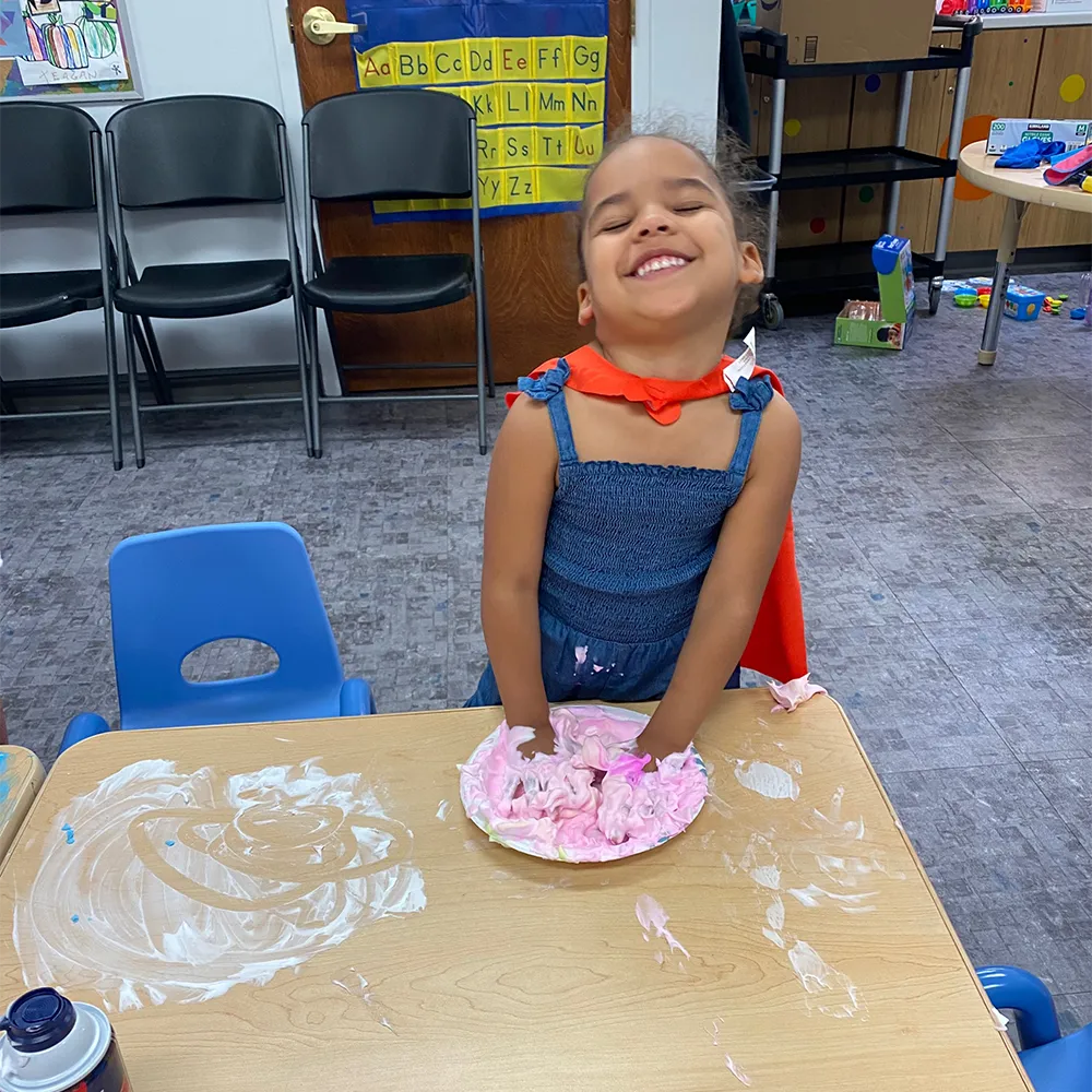 Girl playing with slime at steamworks jr at the Children's Museum of the Upstate Spartanburg location.