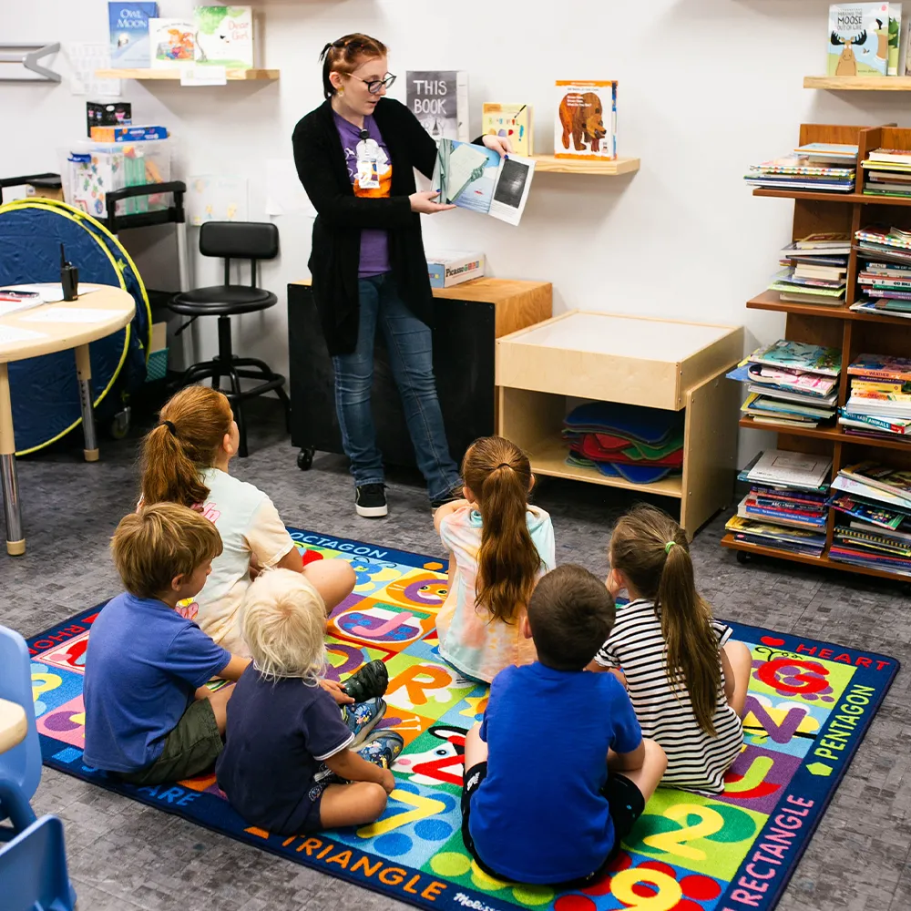 Kids listening to storytime at the Children's Museum of the Upstate Spartanburg location.