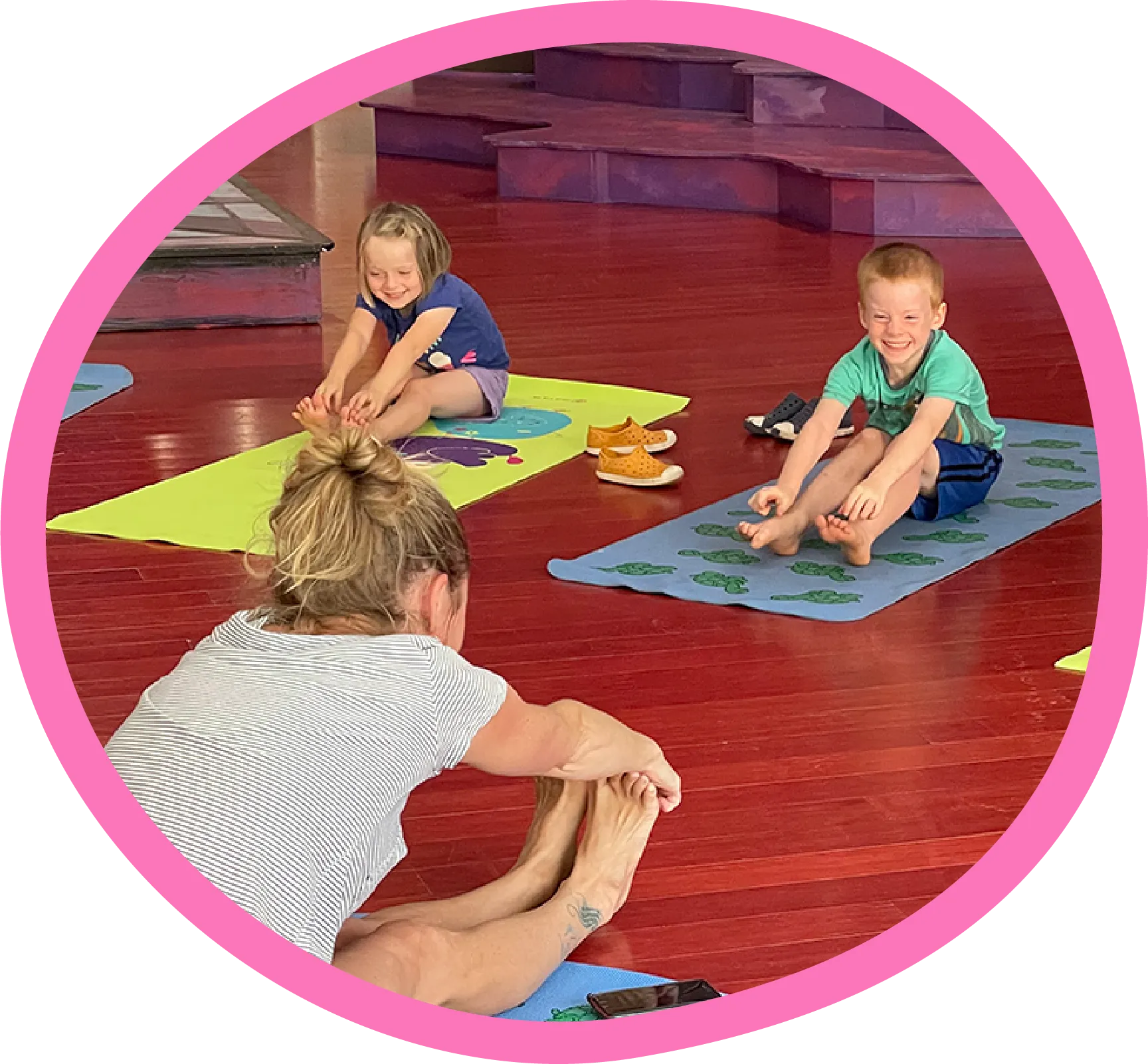 Kids doing yoga in the dream theater exhibit at the Children's Museum of the Upstate Greenville location.