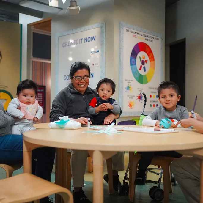 Group of kids doing arts and crafts at the art studio in the Children's Museum of the Upstate Greenville location.