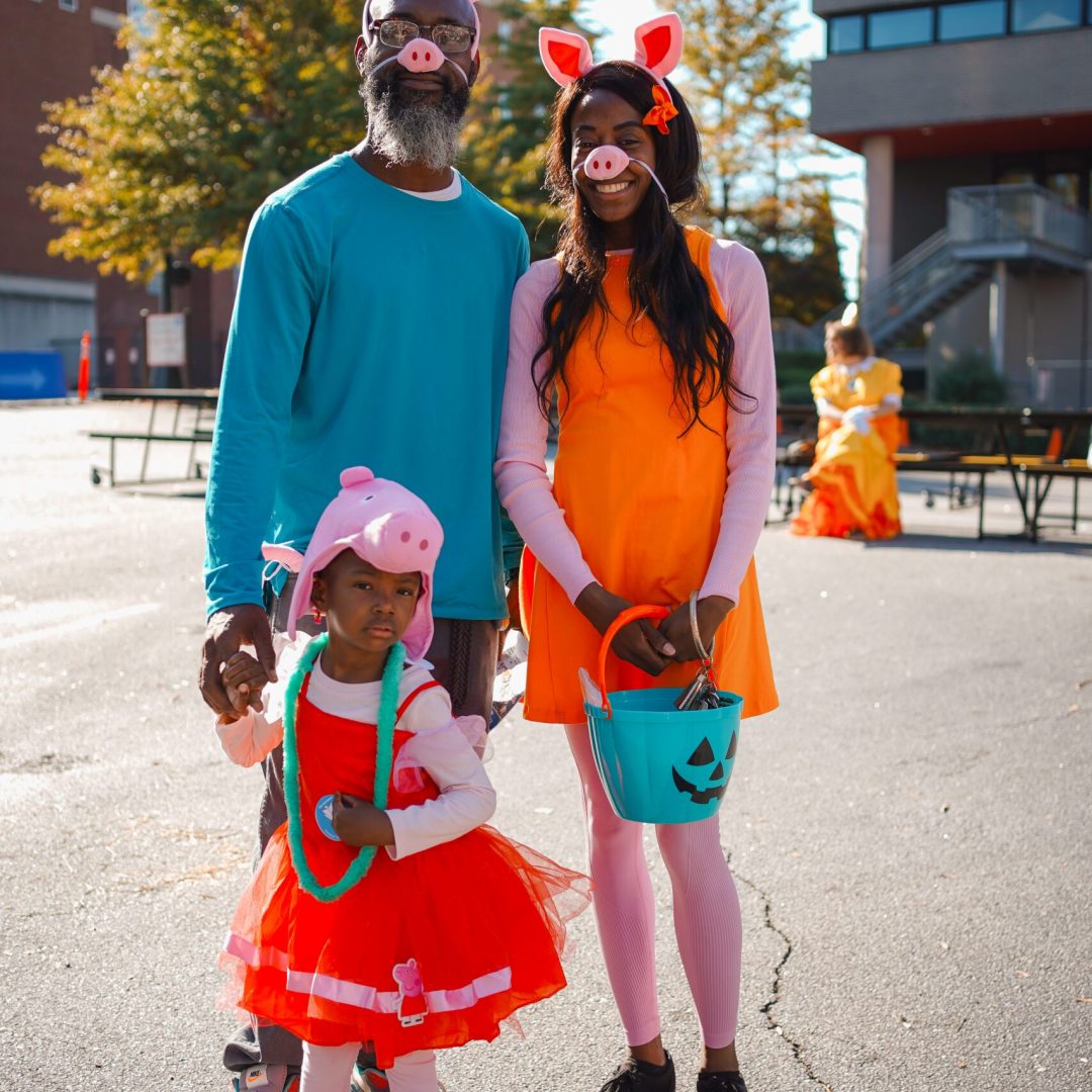 a man and two children dressed up in costumes