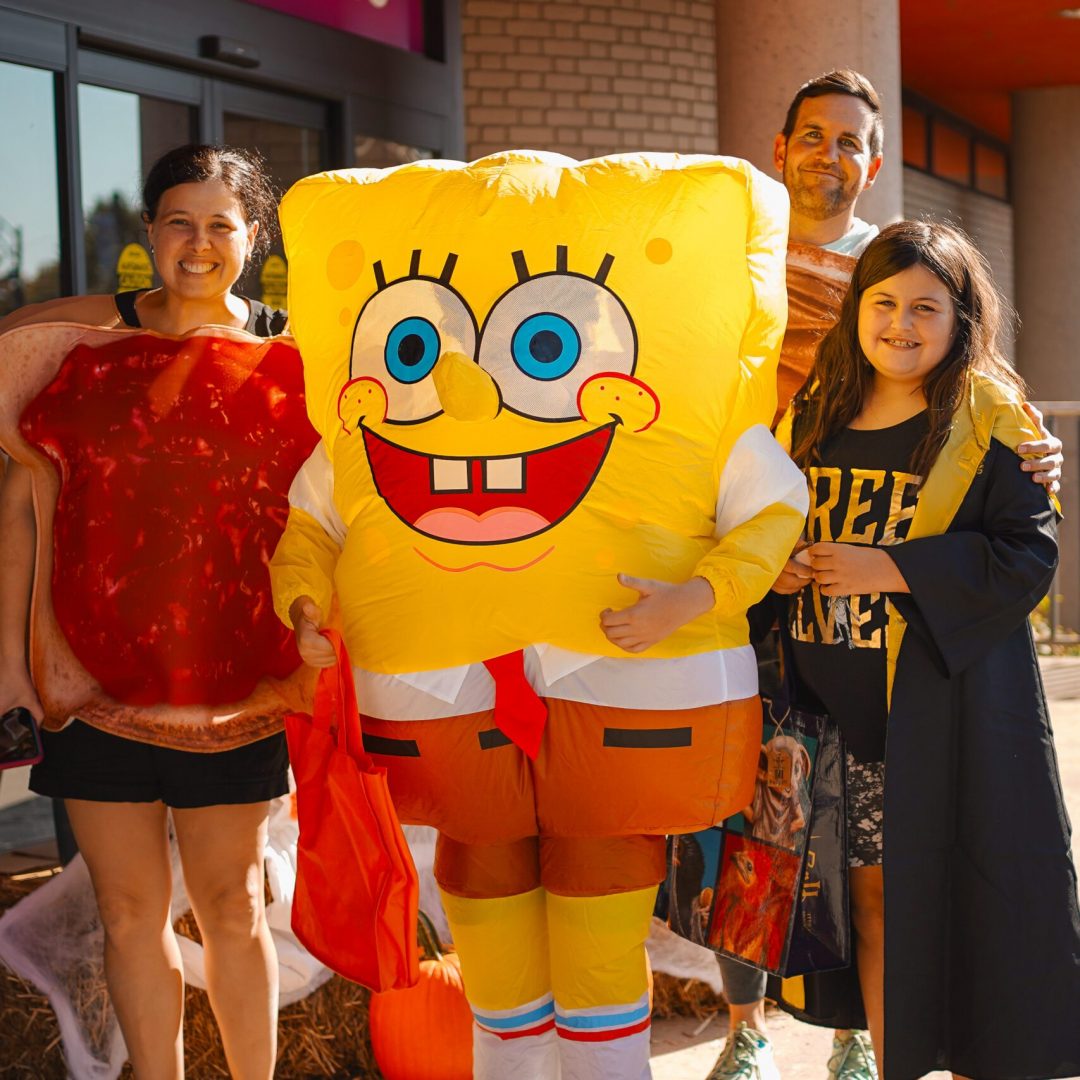 a group of people standing in front of TCMU
